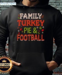 Family enjoying a turkey pie while wearing a cozy football hoodie, perfect for festive gatherings and holiday celebrations.