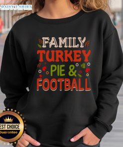 Family enjoying turkey pie while wearing a cozy football sweatshirt, celebrating togetherness and autumn flavors.
