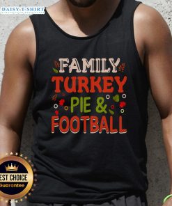 Happy family enjoying turkey pie while wearing football tank tops, celebrating togetherness and delicious food.