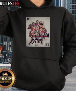 Grimsby Town soccer player wearing a stylish hoodie during a match, showcasing team spirit and athleticism.