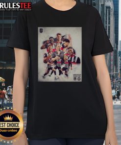 Alt Text: Nice Grimsby Town soccer player in a ladies tee showcasing team spirit on the field during a match.