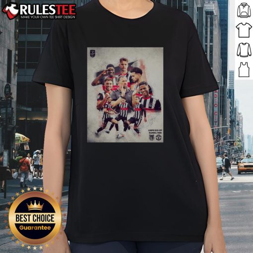 Alt Text: Nice Grimsby Town soccer player in a ladies tee showcasing team spirit on the field during a match.