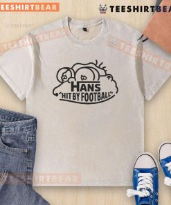 Nice Hans hit by a football while wearing a washed t-shirt, capturing a fun and playful moment in sports.