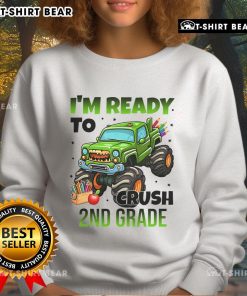 Child wearing a 'Nice, I'm Ready to Crush 2nd Grade' monster truck sweatshirt, showcasing vibrant colors and fun design.