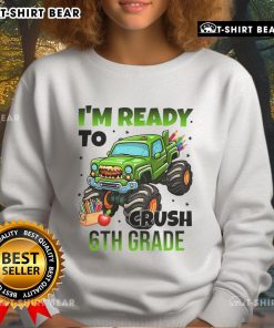 Boy wearing a Nice I'm Ready to Crush 6th Grade Monster Truck sweatshirt, showcasing a fun and vibrant design.