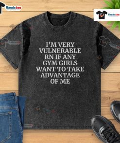 Gym girl in a washed t-shirt expressing vulnerability, inviting connection and support from others in the gym.
