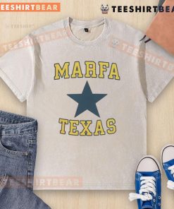 Nice Jensen Ackles wearing a Marfa, Texas washed t-shirt, showcasing a casual style in a scenic outdoor setting.