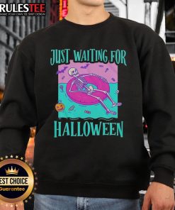 Alt Text: Stylish skeleton sweatshirt featuring 'Just Waiting for Halloween' design, perfect for spooky season fashion.