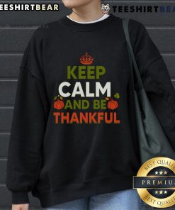 Alt Text: Cozy Thanksgiving sweatshirt featuring 'Keep Calm and Be Thankful' design, perfect for holiday celebrations.