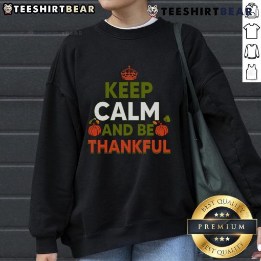 Alt Text: Cozy Thanksgiving sweatshirt featuring 'Keep Calm and Be Thankful' design, perfect for holiday celebrations.