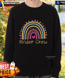 Alt Text: Kindergarten teacher wearing a Nice Kinder Crew rainbow heart sweatshirt, promoting a positive classroom vibe.