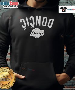 Alt Text: Luka Doncic in a stylish Los Angeles Lakers inverted upside hoodie, showcasing bold team colors and design.