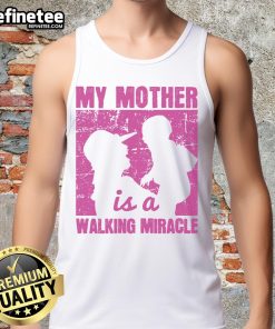 Woman wearing 'My Mother Is A Walking Miracle' tank top, showcasing a stylish and heartfelt tribute to moms.