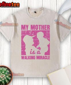 Nice My Mother Is A Walking Miracle washed t-shirt displayed on a hanger, showcasing a heartfelt message for moms.