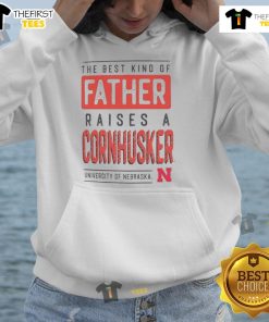 Father wearing a Nebraska Cornhuskers hoodie, showcasing pride for the team and family spirit.
