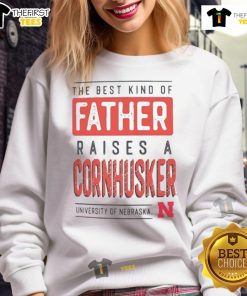 Father wearing a Nebraska Cornhuskers sweatshirt, showcasing pride for the team and family values.
