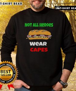 Cozy 'Not All Heroes Wear Capes' sweatshirt featuring a DC-themed design, perfect for fans seeking stylish comfort.