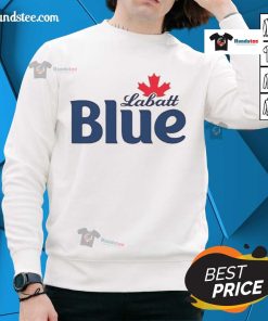 Pamela Anderson wearing a stylish Labatt Blue sweatshirt, showcasing a casual and trendy fashion look.