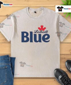 Pamela Anderson wearing a Labatt Blue washed t-shirt, showcasing a casual and stylish summer look.