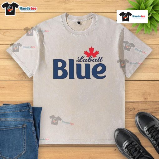 Pamela Anderson wearing a Labatt Blue washed t-shirt, showcasing a casual and stylish summer look.