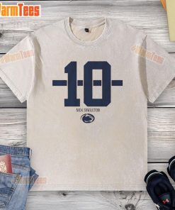 Alt Text: Nicholas Singleton wearing a Penn State Nittany Lions football striped washed t-shirt, showcasing team spirit.
