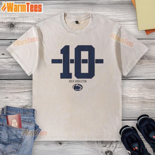 Alt Text: Nicholas Singleton wearing a Penn State Nittany Lions football striped washed t-shirt, showcasing team spirit.