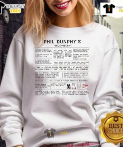 Phil Dunphy's 'Phils-osophy' sweatshirt showcasing humor and style, perfect for fans of Modern Family and cozy fashion.