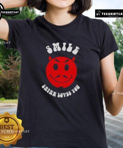 Nice Smile Satan Loves You Ladies Tee featuring a playful design with vibrant colors and a cheerful message.