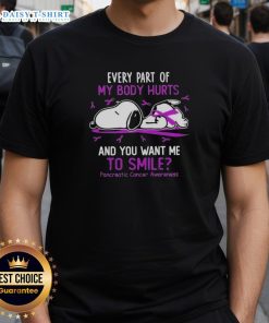 Snoopy graphic on a t-shirt with text about pain and smiling for pancreatic cancer awareness.