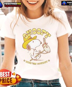 Retro ladies tee featuring Snoopy riding a cowboy, perfect for casual wear and Snoopy fans. Nice Snoopy Ride Em Cowboy design.