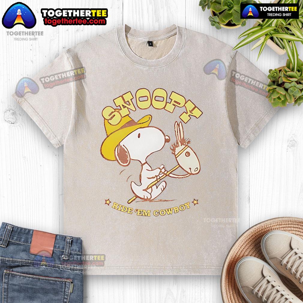 Nice Snoopy Ride Em Cowboy Retro Washed T Shirt Retro washed t-shirt featuring Snoopy riding a cowboy, perfect for casual wear and fans of Peanuts.