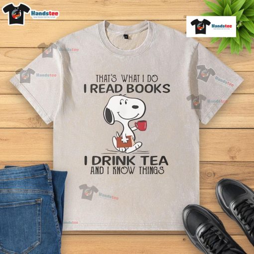 Nice Snoopy t-shirt featuring 'I read books, I drink tea, and I know things' design for book lovers and tea enthusiasts.
