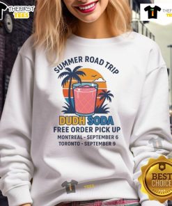 Person wearing a Nice Summer Road Trip Dudh Soda sweatshirt on a scenic drive, capturing summer adventure vibes.