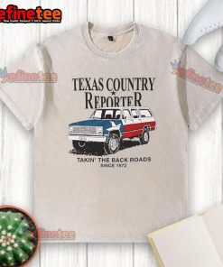 Alt Text: Nice Texas country reporter on back roads since 1972, featuring American flag car and washed T-shirt style.