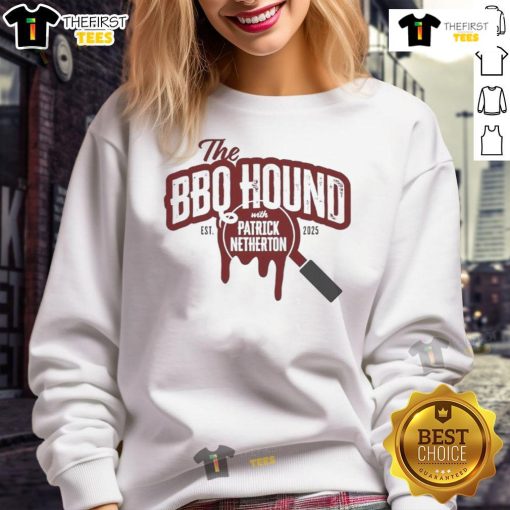 Alt Text: Nice the BBQ Hound wearing a 2025 sweatshirt with Patrick Netherton, showcasing a fun BBQ event atmosphere.