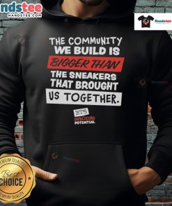 Nice hoodie featuring 'The Community We Build Is Bigger Than Us' slogan, perfect for showcasing unity and togetherness.