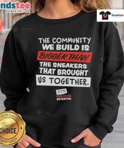 Nice sweatshirt featuring 'The Community We Build Is Bigger Than Us' design, promoting unity and togetherness.