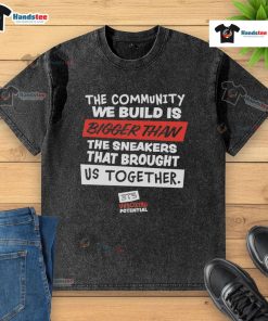 Nice washed t-shirt featuring 'The Community We Build is Bigger Than Us' slogan, promoting unity and togetherness.