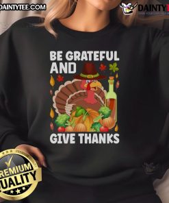 Thanksgiving sweatshirt featuring a turkey and wine design with 'Be Grateful and Give Thanks' message.