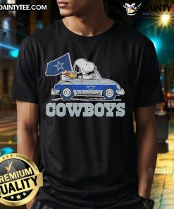 Official 2025 Snoopy and Woodstock Car Logo Cowboys T-Shirt featuring vibrant graphics and a stylish design for fans.