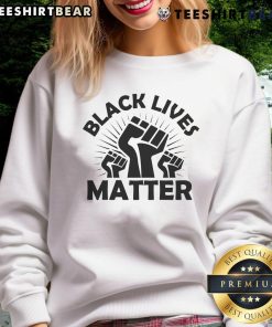 Alt Text: Official Black Lives Matter sweatshirt featuring a bold black fist design, symbolizing unity and strength in activism.