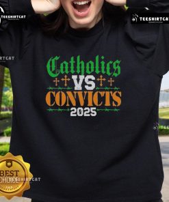 Official Catholics vs Convicts 2025 Sweatshirt featuring bold graphics and vibrant colors for fans and supporters.