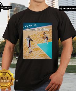 Alt Text: Official Curry LeBron Basketball USA Almost Friday T-Shirt featuring vibrant graphics and a comfortable fit for fans.
