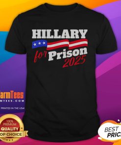 Official Hillary For Prison 2025 MAGA T-Shirt featuring bold text and patriotic colors for political statement wear.