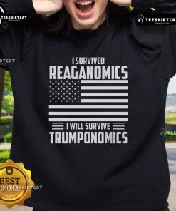 Cozy sweatshirt featuring 'I Survived Reaganomics, I Will Survive Trumponomics' slogan, perfect for political enthusiasts.
