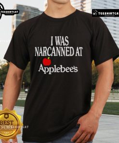 Official 'I Was Narcanned At Apple' T-Shirt featuring bold text on a stylish black background, perfect for Apple fans.