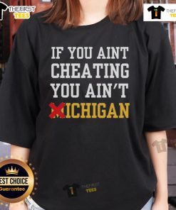 Alt Text: Official 'If You Ain't Cheating, You Ain't Michigan' ladies tee featuring stylish design and vibrant colors.