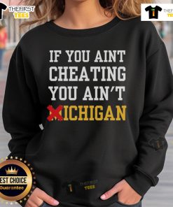 Official 'If You Ain't Cheating, You Ain't Michigan' sweatshirt showcasing Michigan pride and sports humor.