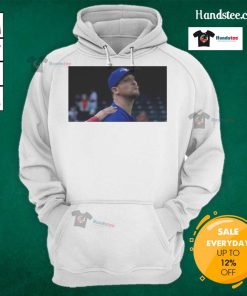 Jeff Hoffman blowing a kiss while wearing a Toronto Blue Jays baseball hoodie, showcasing team spirit.