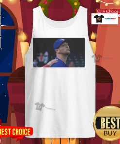 Jeff Hoffman blowing a kiss in a Toronto Blue Jays baseball tank top, showcasing team spirit and sporty style.